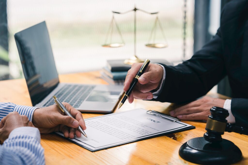 Male Notary lawyer or judge consult or discussing contract papers with Businessman client in the off